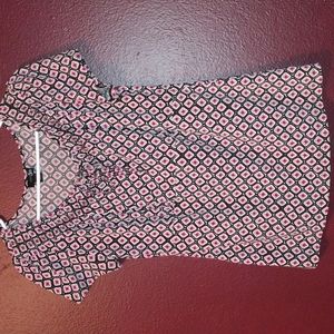 Work top, with brown, pink, orange and white print.